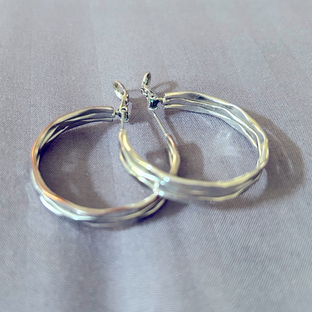 Silver hoop earrings pierced